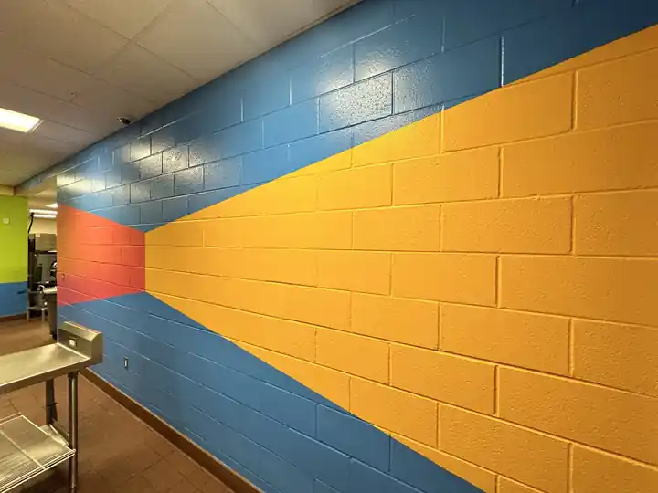 A painted block wall with a stripe